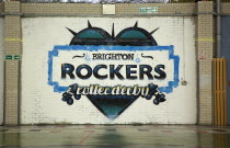 Art, Graffiti, former parcel delivery warehouse converted into roller disco with the walls decorated by local graffiti artists. Painted logo for Brighton Rockers Rollerderby.