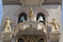 Italy, Sicily, Messina, Piazza Del Duomo, Cathedral bell tower with golden statues.
