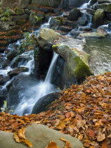 England, Surrey, Virginia Water, Waterfall in autumn.