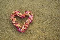 USA, Hawaii, Oahu Island, Heart shaped lei on Waikiki beach.