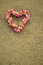 USA, Hawaii, Oahu Island, Heart shaped lei on Waikiki beach.