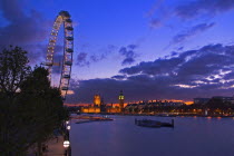 England, London, Houses of Parliament and London Eye at dusk.
