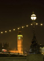 England, London, Big Ben across Westminster Bridge at night.