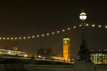 England, London, Big Ben across Westminster Bridge at night.