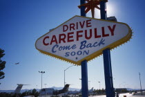 USA, Nevada, Las Vegas, Drive Carefully Come Back Soon sign on the Strip next to McCarran Airport