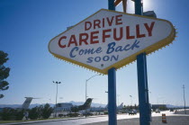 USA, Nevada, Las Vegas, Drive Carefully Come Back Soon sign on the Strip next to McCarran Airport