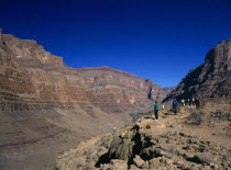 USA, Arizona, Grand Canyon, tourists looking down onto the Colorado river from within the Hualapai Indian reservation part of the national park.