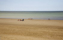 England, Lincolnshire, Skegness, Lincs Wind Farm  offshore on the horizon showing turbine blades.