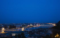 Hungary, Budapest,Buda Castle District: view over Danube and Pest with Memorial Chain Bridge illuminated.