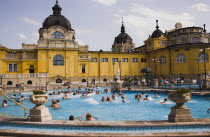 Hungary, Budapest, Pest, Outdoor bathing in summer at Szechenyi thermal baths, largest in Europe.