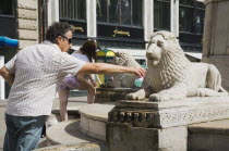 Hungary, Budapest, Lion fountain in central Pest.