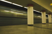 Hungary, Budapest, Underground train leaving platform on Metro system.