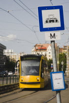 Hungary, Budapest, Tram arriving at stop in Pest city centre.