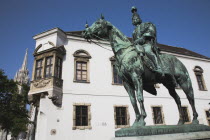 Hungary, Budapest, Buda Castle District: Bronze statue of mounted Hussar with Matyas Church tower behind.