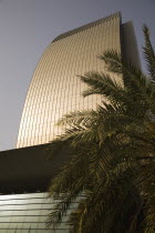 UAE , Dubai, National Bank of Dubai building shining in afternoon sunlight overlooking the Creek.