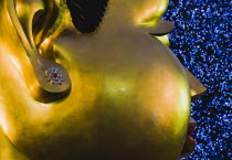 Thailand , Bangkok, Contemporary Statue head with Christmas tree outside shopping mall.