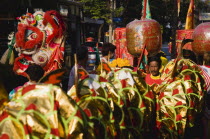 Thailand, Bangkok, Dragon and Chinese Lanterns carried in parade celebrating local temple.