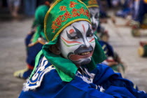 Thailand, Bangkok, Thai boy in Chinese character costume in dance troupe celebrating local temple.