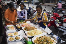 Thailand, Bangkok, Street vendor sells take away Pad-thai the national fried noodle classic dish.
