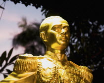 Thailand, Bangkok, Gold Royal statue in military uniform.