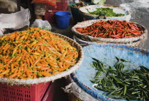 Thailand, Bangkok, Red, green and yellow chilis in Chinatown market.