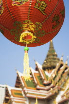 Thailand, Bangkok, Wat Yannawa temple roof and  red lantern at Chinese New Year.