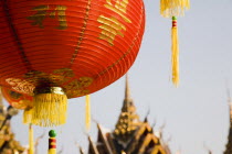 Thailand, Bangkok, Wat Yannawa temple roof and  red lantern at Chinese New Year.