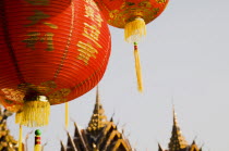 Thailand, Bangkok, Wat Yannawa temple roof and  red lantern at Chinese New Year.