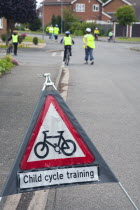 England, Lincolnshire, School children being taught cycle safety lessons on public roads.