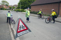 England, Lincolnshire, School children being taught cycle safety lessons on public roads.