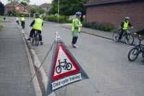 England, Lincolnshire, School children being taught cycle safety lessons on public roads.
