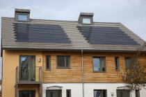 England, West Sussex, Chichester, Graylingwell Park, Modern housing with solar panels blended seamlessly in to roof tiles.