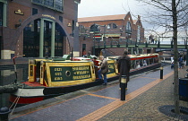 England, Birmingham, Canal barge tourist boat next to the International Conference Centre