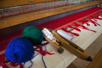 Greece, Ioannina, Zagorohoria, Close of an old traditional loom with balls of wool and tools.