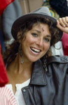 USA, California, Smiling teen girl wearing hat and leather jacket.
