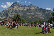 Canada, Alberta, Waterton Lakes National Park, Pow Wow Grand Entry at the Blackfoot Arts & Heritage Festival to celebrate Parks Canada's centennial, Flags of Canada and the United States, RCMP Mountie...