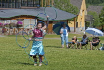 Canada, Alberta, Waterton Lakes National Park, Blackfoot Arts & Heritage Festival to celebrate Parks Canada's centennial, Hoop dancerfrom the Samson Cree Nation, Tourists watching the event, Waterton...