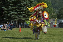 Canada, Alberta, Waterton Lakes National Park, Blackfoot dancer in the Men's Fancy Dance at the Blackfoot Arts & Heritage Festival Pow Wow organized by Parks Canada and the Blackfoot Canadian Cultural...