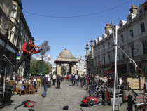 England, East Sussex, Brighton, Pavillion Tightrope walker street performer during the annual Arts festival.