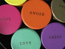 England, West Sussex, Chichester, Colourful trinket boxes on a market displaying the words of the Seven Deadly Sins.