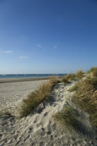 England, West Sussex, West Wittering Beach, East Head, Sand dunes and beach with sunshine and blue sky