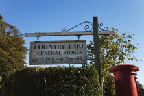 Shops, Village store sign and red postbox.