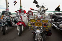 England, East Sussex, Brighton, Elaborately decorated Mopeds on Madeira Drive during motorbike festival.