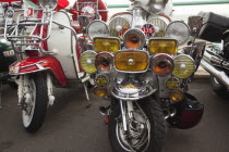 England, East Sussex, Brighton, Elaborately decorated Mopeds on Madeira Drive during motorbike festival.