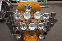 England, East Sussex, Brighton, Elaborately decorated Mopeds on Madeira Drive during motorbike festival.