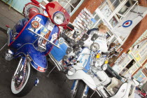 England, East Sussex, Brighton, Elaborately decorated Mopeds on Madeira Drive during motorbike festival.