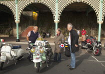 England, East Sussex, Brighton, Elaborately decorated Mopeds on Madeira Drive during motorbike festival.