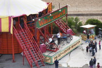 England, East Sussex, Brighton, Wall of death motorcycle fairground attraction on Madeira Drive during motorbike festival.