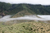 Nepal, Upper Mustang, Morning cloud is floating near the small mountain near Samar village.