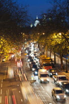 England, London, Rush hour traffic along the Embankment with St Paul's Cathedral in the background.